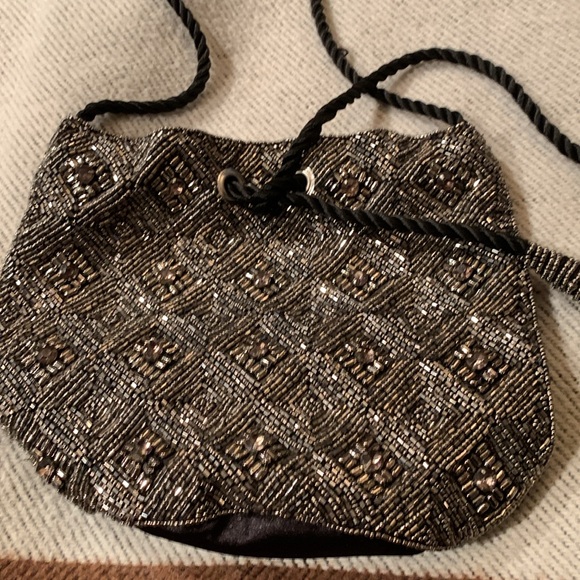 Beaded and jeweled bag with ties Long strap/cord.
Great bag Very decorative - Picture 4 of 6